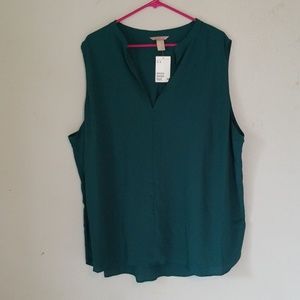 Jade green, sleeveless blouse.